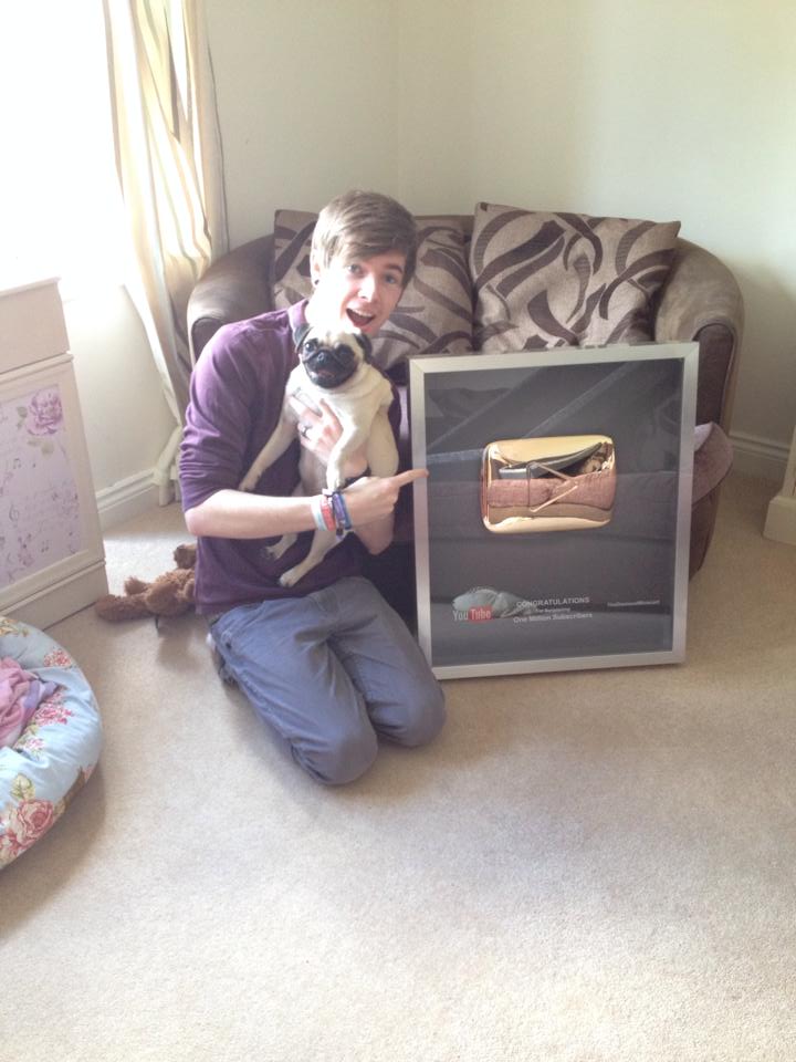 DanTDM with his Gold Play Button DanTDM with his Gold Play Button