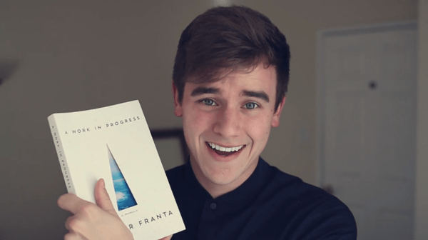 Connor Franta with his book