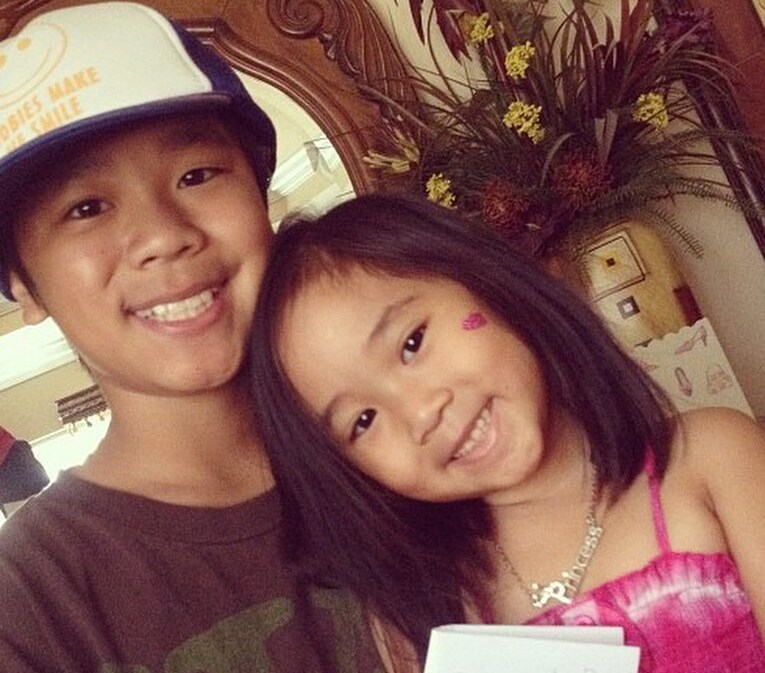 Young Michael Le with his sister Young Michael Le with his sister